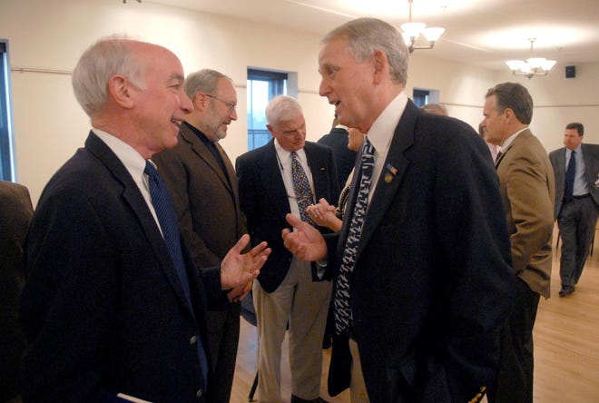 U.S. Rep. Joe Courtney, D-2nd District, talks with former Congressman Rob Simmons before a meeting Thursday in New London about how defense reductions Congress is considering could affect the Groton sub base.