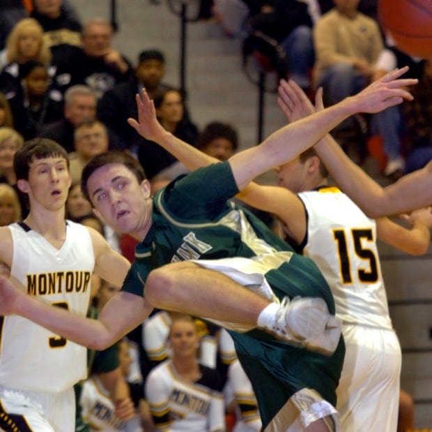 Blackhawk's Nick Martin try to pass the ball in a crowd during Friday's WPIAL Class AAA quarterfinal against Montour.