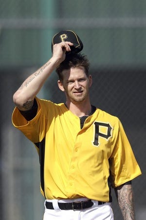 Pirates pitcher A.J. Burnett practices at spring training Tuesday.
