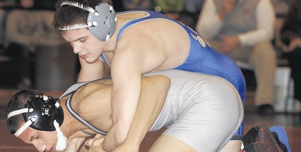 Pleasant Valley's Sean Bianco, top, takes control of his 113-pound final-round match against Stroudsburg's Guesseppe Rea at the District 11 tournament at Liberty High School on Saturday.