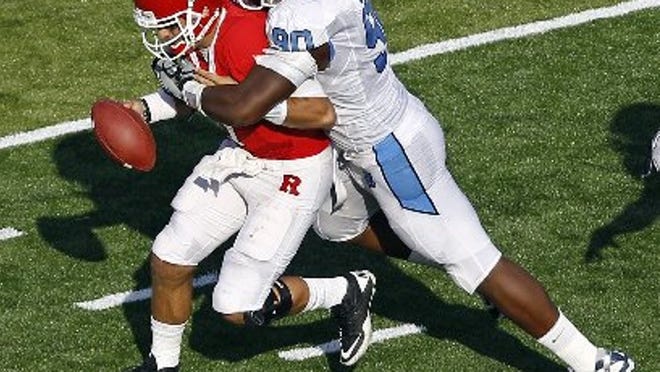 North Carolina's Quinton Coples, shown chasing down Rutgers QB.Tom Savage.