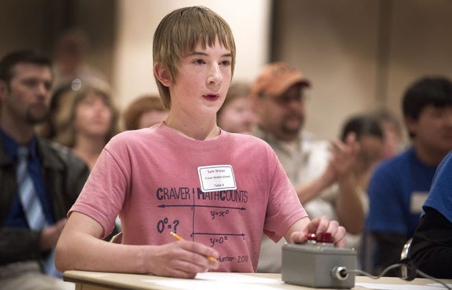 Craver Middle School student Sam Wolyn, 13, buzzes in to answer during the final round of the Mathcounts competition Saturday at Colorado State University-Pueblo. He outlasted 36 other competitors to take top honors in the event. Photo by Chris McLean 2-25-12