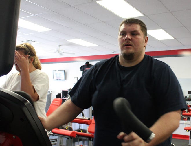 Photo by Derek Prall / New Jersey Herald - Brian Vaughan, of Andover Township, works out on an elliptical machine after working out with his trainer at Snap Fitness in Wantage. Vaughan will soon be the lightest he has ever been in his adult life.