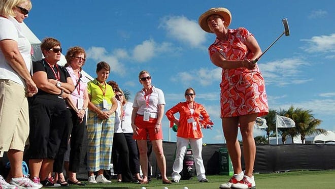 Former LPGA star Michelle McGann gives tips on putting during the inaugural Executive Women's Day at the Honda Classic.