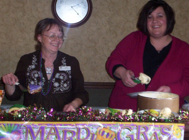 Sunset celebrates Mardi Gras
Kathy Negley, Activity Director, and Erin Merrill, Assistant Activity Directory/Assistant Social Service Director, at Sunset Rehabilitation and Health Care serve King Cake and ice cream to the resident during their Mardi Gras party.
