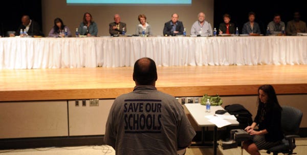 Larry Gambill of East Stroudsburg addresses the East Stroudsburg school board Friday. The board held a hearing to allow people to share their opinions about closing schools.