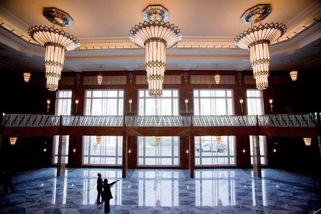 Visitors touring the nearly completed Smith Center for the Performing Arts take in the art deco-style architecture Feb. 16 in the grand hall entrance in Las Vegas.