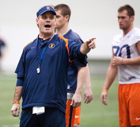 New Illinois head football coach Tim Beckman makes a points to his players during spring workouts in Champaign.