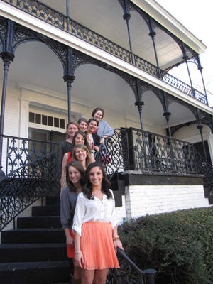 Photo by Lee Shearer Phi Mu officers (front to back) Julia Battinelli, Margaret Sikes, Blakely Brown, Lauren Spratte, Tess Rock, Molly Kalinsky, Sydney Graham and Elena Wathen stand in front of the sorority's Millege Avenue house. The UGA Alumni Association honored the sorority as UGA's oldest Monday.