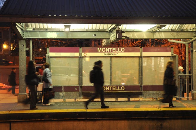 Commuters get off the train at Montello commuter rail station in Brockton.