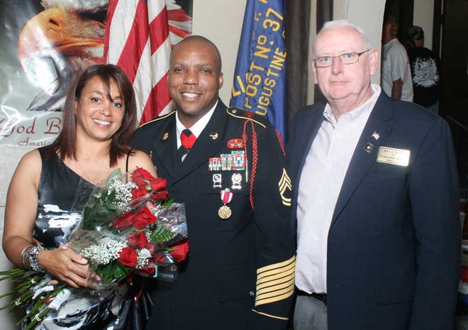 A retirement celebration was recently held at the Charles F. Hamblen American Legion Post 37 for SFC Adrian White. Pictured from left: White's wife, Nicole, White and Commissioner Ray Quinn. Also in attendance was the post commander Richard White. Contributed photo.
