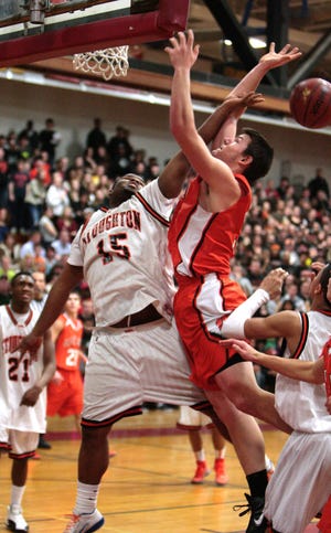 Stoughton High School's Raymond Bowdre and Oliver Ames High School's Jeff Babbitt fight for a rebound during the semifinal tournament game in Brockton on Tuesday, March 6, 2012.