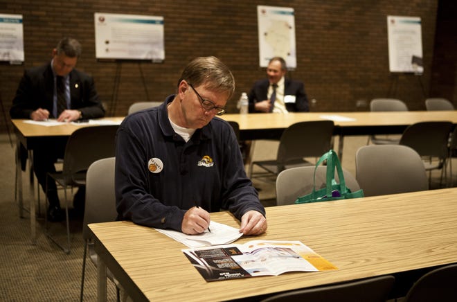 Tom Hutchison fills out a comment form during an informational meeting on high-speed rail and long-term rail improvements at the Lincoln Library in Springfield, Ill., Tuesday, March 6, 2012. Justin L. Fowler/The State Journal-Register