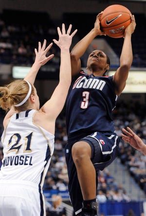 Connecticut's Tiffany Hayes, right, shoots as Notre Dame's Natalie Novosel defends during the first half of an NCAA college basketball game in the final of the Big East women's tournament in Hartford, Conn., Tuesday, March 6, 2012.Novosel fouled Hayes on the shot. (AP Photo/Jessica Hill)