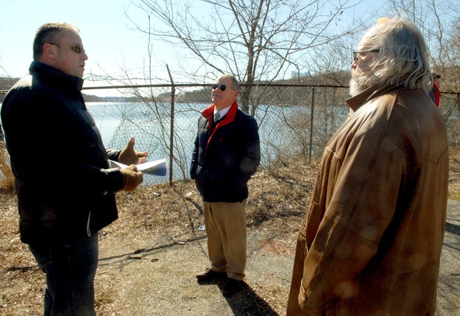 Micheal Grzywinski, from the state Department of Energy and Environmental Protection, left, talks with Norwich Alderman Tucker Braddock and Harbor Management Commission Chairman John Paul Mereen about the commission’s proposal for a boat launch on Shipping Street.