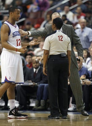 The Sixers' Evan Turner (left) and coach Doug Collins make their case with official Violet Palmer during a Feb. 8 home loss to the Spurs.