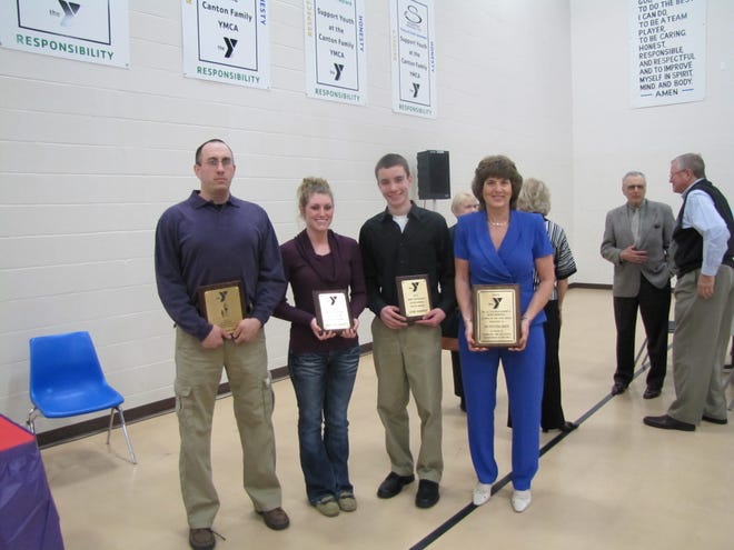 Canton YMCA awards were given to, from left, Mike Eveland (Vic Sereno Contribution to Youth Award), Erin O’Flaherty (Mike Chianakas Outstanding Youth Award), Cory Barnes (Mike Chianakas Outstanding Youth Award), and Dee Doubet who is accepting the Coleman-Wood Layperson of the Year Award on behalf of Jo Potter Keen.
