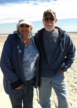 Bill and Stephanie Besser walk East Beach, the longest stretch of beach on St. Simons Island, Ga.