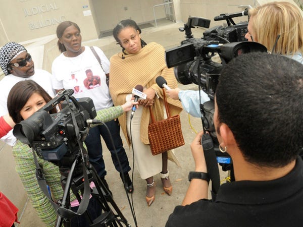 Marvin Batts and Shantelle Colvin, the parents of 8 -year-old Jamiah Tigeria Batts, and Alfredia McDonald, Jamiah's great aunt, talk to members of the media with in front of the New Hanover County Judicial building in Wilmington on Friday.
