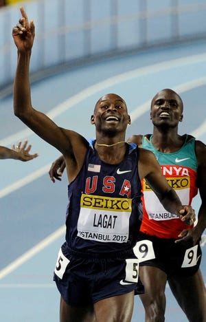 American Bernard Lagat celebrates as he crosses the finish line to win gold in the men's 3000-meter race at the world indoor championships.