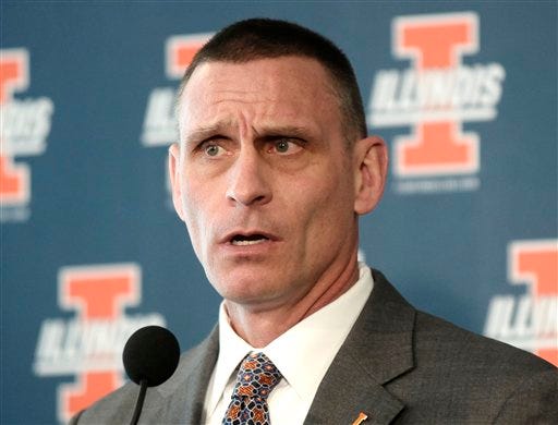 Illinois athletic director Mike Thomas announces the firing of basketball head coach Bruce Weber during a news conference in Champaign, Ill., on Friday March 9, 2012. (AP Photo/News-Gazette, John Dixon)