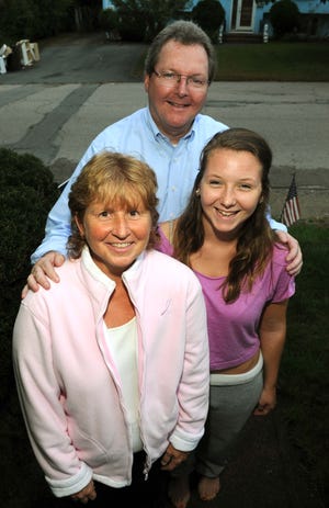 Mary Waldron, Brockton, and her husband John , and daughter Casey, 17, on September 29, 2011.