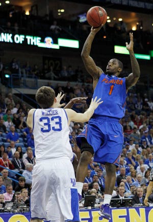Florida guard Kenny Boynton (1) shoots over Kentucky forward Kyle Wiltjer (33)during the first half of an NCAA college basketball game in the semi-final round of the 2012 Southeastern Conference tournament at the New Orleans Arena in New Orleans, Saturday, March 10, 2012. (AP Photo/Gerald Herbert)