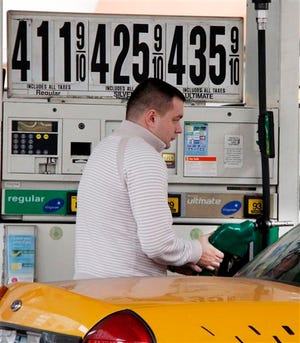 In this March 2, 2012 photo, a New York City taxi driver pumps gas at a BP mini-mart, in New York. Experts say pump prices are rising on the expectation that supplies will dip next month while refineries switch from winter to summer gasoline blends. Forecasts see gas rising as high as $4.25 per gallon in late April. (AP Photo/Gene J. Puskar)
