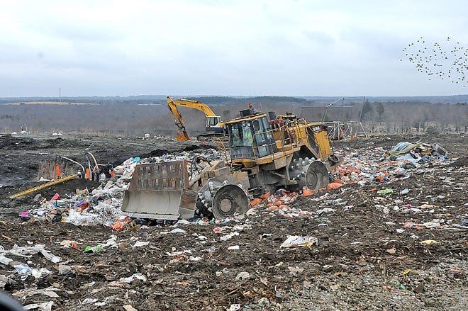 A landfill compactor workls at the Taunton landfill.