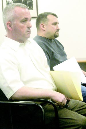 Scott, left, with associate Jeff McClelland at the house meeting.