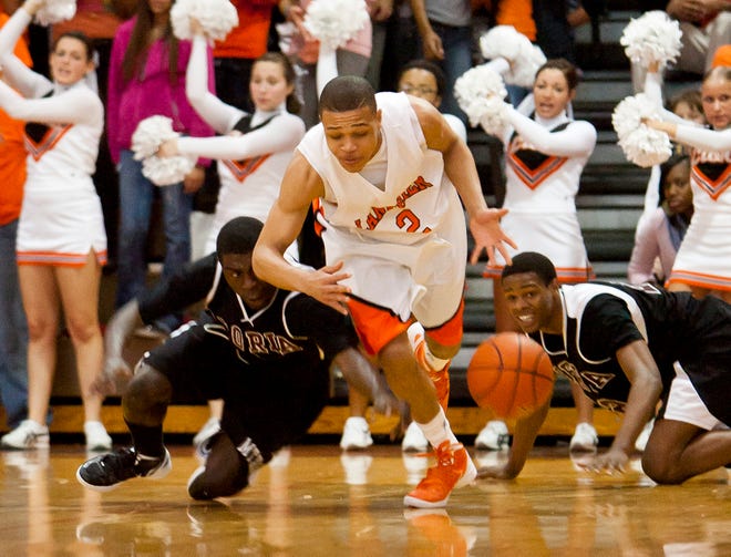 Lanphier sophomore Larry Austin Jr. (2) picks up a steal against Peoria Central during the first half at Lanphier High School in Springfield, Ill., Saturday, Feb. 18, 2012.