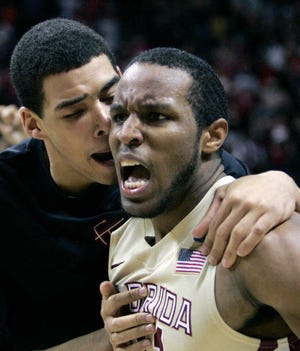 Florida State's Michael Snaer, right, celebrates his game-winning 3-point shot with teammate Kiel Turpin in the final seconds of an NCAA college basketball game against Virginia Tech on Thursday, Feb. 16, 2012 in Tallahassee, Fla. Florida State won 48-47. (AP Photo/Steve Cannon)