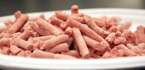 In this undated image released by Beef Products Inc., boneless lean beef trimmings are shown before packaging. The debate over “pink slime” in chopped beef is hitting critical mass. The term, adopted by opponents of “lean finely textured beef,” describes the processed trimmings cleansed with ammonia and commonly mixed into ground meat. Federal regulators say it meets standards for food safety. Critics liken it to pet food -- and their battle has suddenly gone viral amid new media attention and a snowballing online petition.