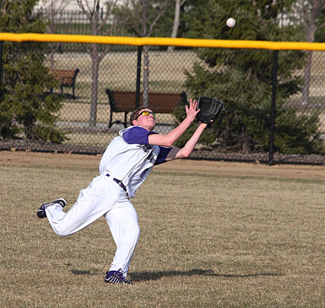 Lexington right fielder Ted Lingle chases down a fly ball during Wednesday’s nonconference baseball game, a 6-2 Central Catholic win, in Bloomington.