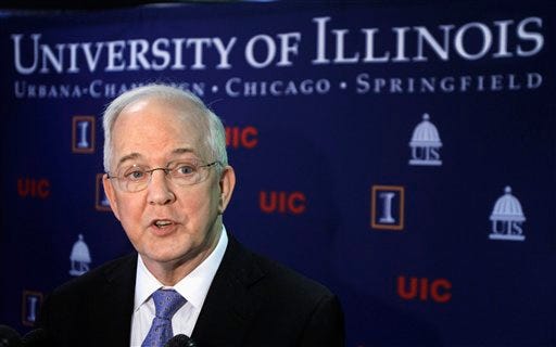 In this March 23, 2011 file photo, University of Illinois President Michael Hogan participates in a university board of trustees meeting in Springfield, Ill. In a letter Monday, Feb. 27, 2012, Christopher Kennedy, chairman of the University of Illinois Board of Trustees, said he fully supports Hogan in spite of calls from some faculty for him to resign. Hogan has been under pressure from faculty over plans to centralize enrollment management and what they say is bullying of Urbana-Champaign Chancellor Phyllis Wise to back him. (AP Photo/Seth Perlman, File)