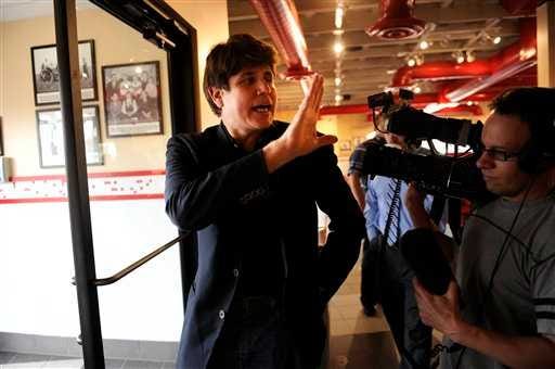 Former Illinois Gov. Rod Blagojevich waves toe the media after his brief stop at Freddy's Frozen Custard & Steakburgers before turning himself in to the Federal Correctional Institution (FCI) Englewood just a few minutes away in Littleton, Colo. on Thursday, March 15, 2012. Blagojevich will begin serving his 14-year sentence for corruption at the jail facility. (AP Photo/The Denver Post, Joe Amon ) MAGS OUT; TV OUT; INTERNET OUT