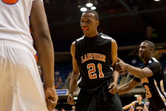 Lanphier senior Aaron Powers (21) is fired up after getting a basket against East St. Louis during the first half of the Class 3A Springfield Supersectional at the Prairie Capital Convention Center in Springfield, Ill., Tuesday, March 13, 2012.