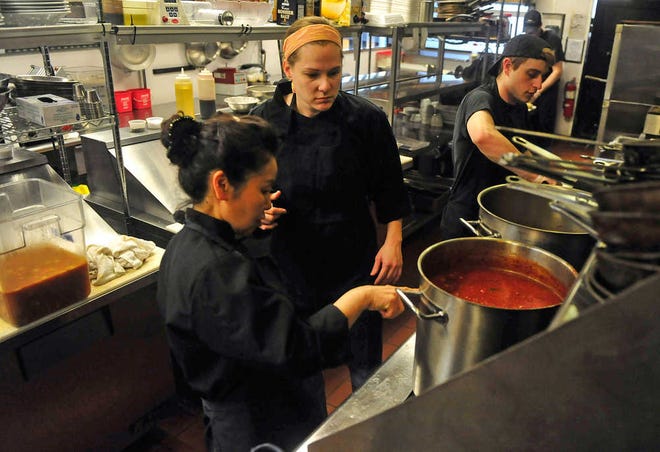 Richard Hamm/Staff Restaurant manager Lauren Stripling, center, trains Yungae Lin, left, at the Timothy Road DePalmas location on Tuesday, March 13, 2012 in Athens, Ga.