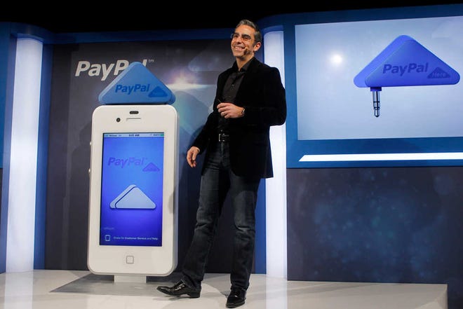 This photo provided by PayPal, David Marcus, PayPal Vice President and General Manager of Mobile, unveils PayPal Here in San Francisco, Calif., March 15, 2012. PayPal Here, the service is similar to existing mobile payments services such as Square. Customers will be able to pay using credit cards, their PayPal accounts or, in the U.S., checks. But they won't need a PayPal account to do so. (AP Photo/PayPal, Kim White)