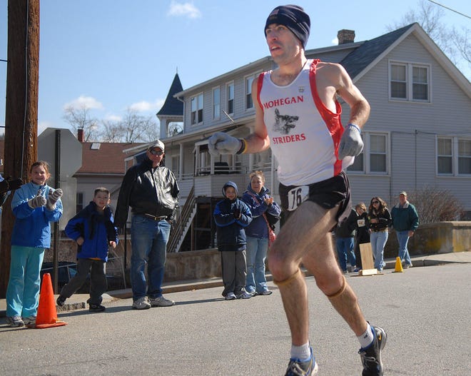 Five-time defending St. Joseph School Road Race champion Jeff Wadecki has his sights set on breaking the course record of 14 minutes, 48 seconds, set by Chad Johnson, inset, in 2002. The road race will be held March 31 in Baltic.