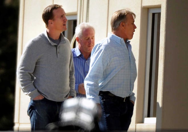 FILE - In this March 9, 2012 file photo, Peyton Manning, left, takes a tour with executive vice president of football operations for the Denver Broncos John Elway, right, and Broncos coach John Fox at the Broncos' training facility in Englewood, Colo. ESPN is reporting that Manning is negotiating to join the Broncos. Citing anonymous sources Monday, March 19, 2012, ESPN said that the four-time MVP has instructed agent Tom Condon to negotiate to complete a deal with Denver. (AP Photo/The Denver Post, John Leyba) MAGS OUT; TV OUT; INTERNET OUT