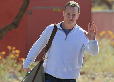 NFL quarterback Peyton Manning leaves the Arizona Cardinals training facility after a five-hour meeting with coaches and front office staff in Tempe, Ariz. last week. AP File Photo.