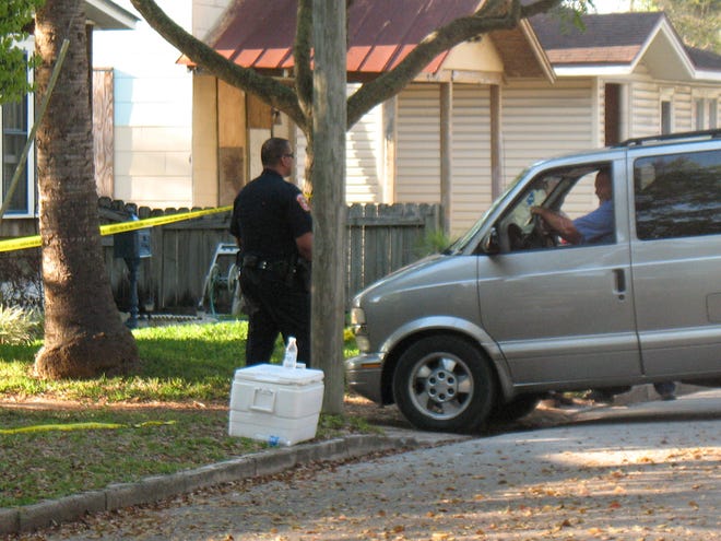 A Tri-County Medical Examiner van drives onto the property at 126 1/2 Cunningham Ave. on Sunday to retrieve the body of 40-year-old St. Augustine resident David Blythe, who was shot and killed outside the home Sunday afternoon after jumping into the back of a family's car nearby.