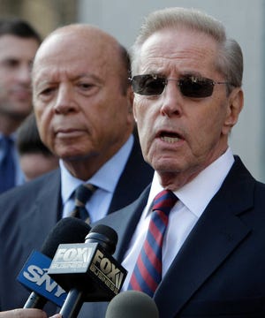 New York Mets owners Fred Wilpon, right, and Saul Katz talk to the media in front of federal court in New York on Monday.
