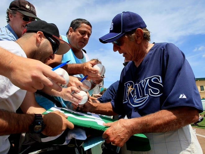 NFL Hall of Famer Joe Namath was a guest of Rays manager Joe Maddon, for the game at Roger Dean Stadium in Jupiter. Namath signed a few autographs on his way to the dugout. (ALLEN EYESTONE | THE ASSOCIATED PRESS)