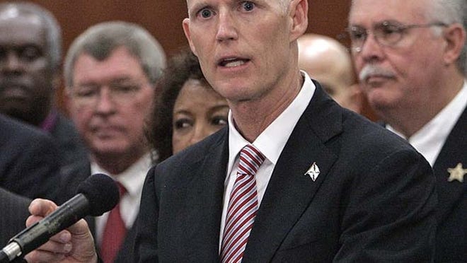 In this March 28, 2011 file photo, Florida Gov. Rick Scott speaks at a news conference in Tallahassee.