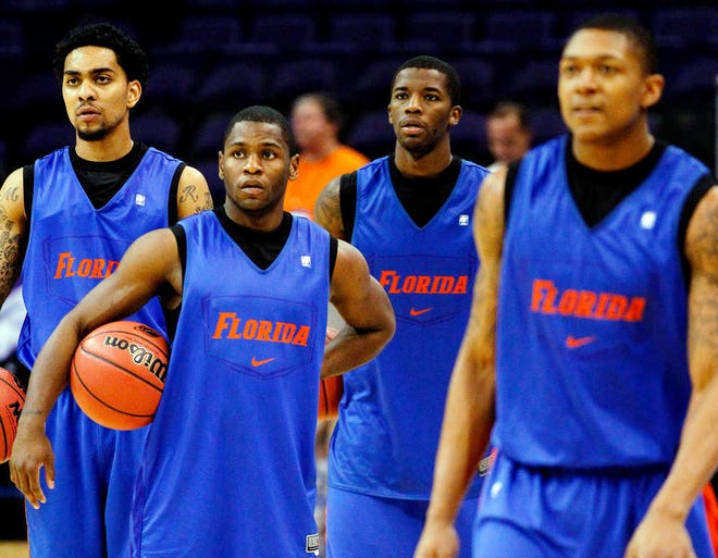 From left, Florida's Mike Rosario, Kenny Boynton, Casey Prather and Bradley Beal look on during practice, Wednesday, March 21, 2012, in Phoenix. Florida is scheduled to face Marquette in an NCAA tournament semifinal college basketball game on Thursday. (AP Photo/Matt York)
