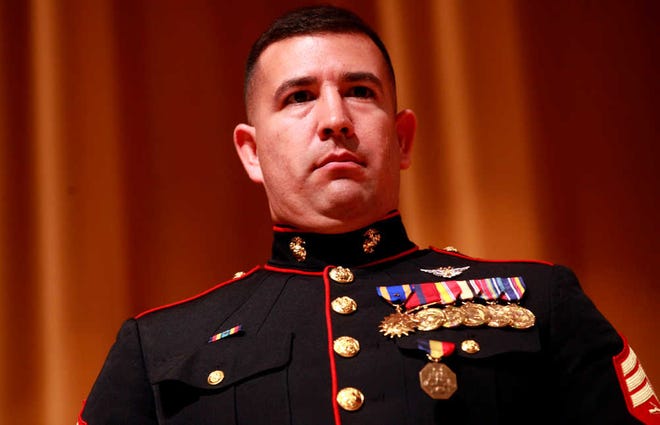 Marine Sgt. Stephen Sanchez stands with the his newly awarded Navy and Marine Corps Medal pinned to his chest pocket at Coronado High School Wednesday, March 21, 2012. The Marine recruiter was honored for his assistance with a motor vehicle accident in March of 2011. The award recognizes actions not in combat. Stephen Spillman / Avalanche-Journal