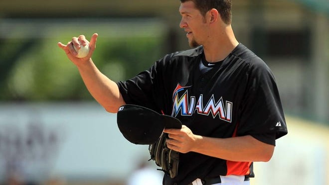 Marlins ace Josh Johnson gestures during his spring training outing against the Tampa Bay Rays on Tuesday, March 20, 2012, in Jupiter.