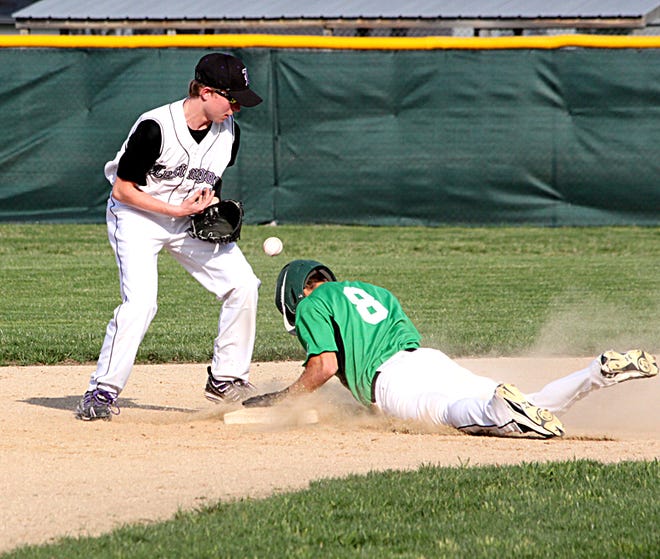 Lexington seocnd baseman Ted Lingle tries to grab the ball as a Eureka runner slides into second base in Wednesday’s nonconference baseball game.